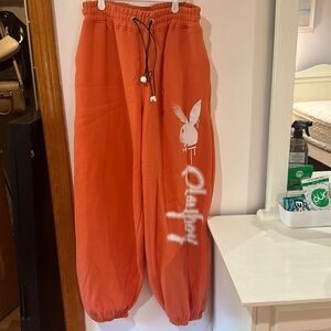 Baggy orange playboy sweatpants from missguided